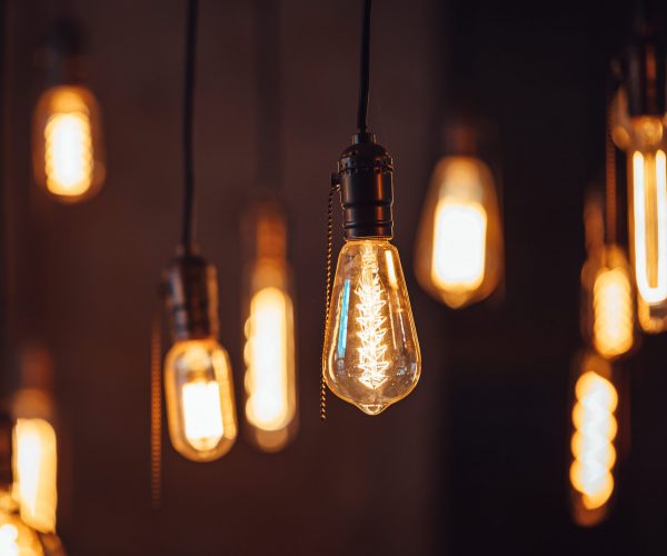 Bright retro lamps hanging on the ceiling of a modern house or cafe